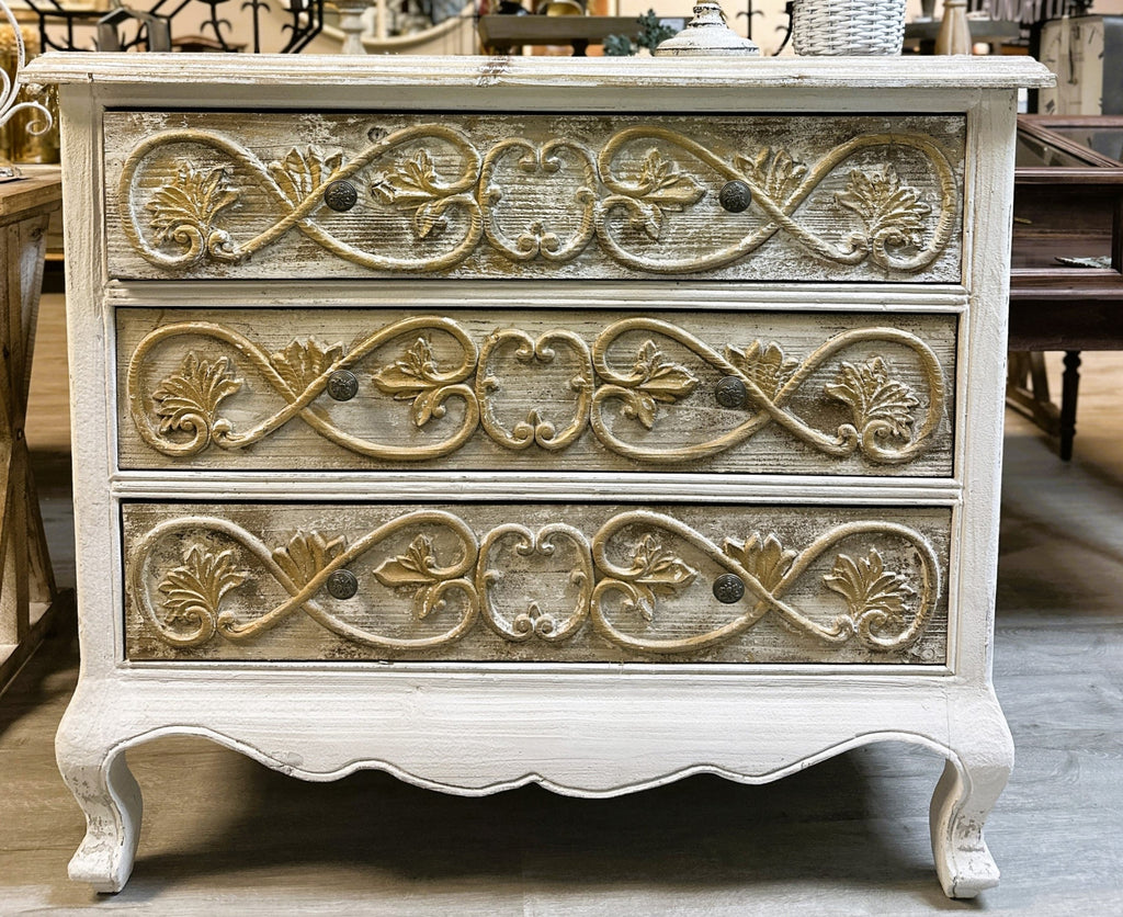 Three-tier French-style carved chest in distressed ivory finish with gold relief detailing and cabriole legs