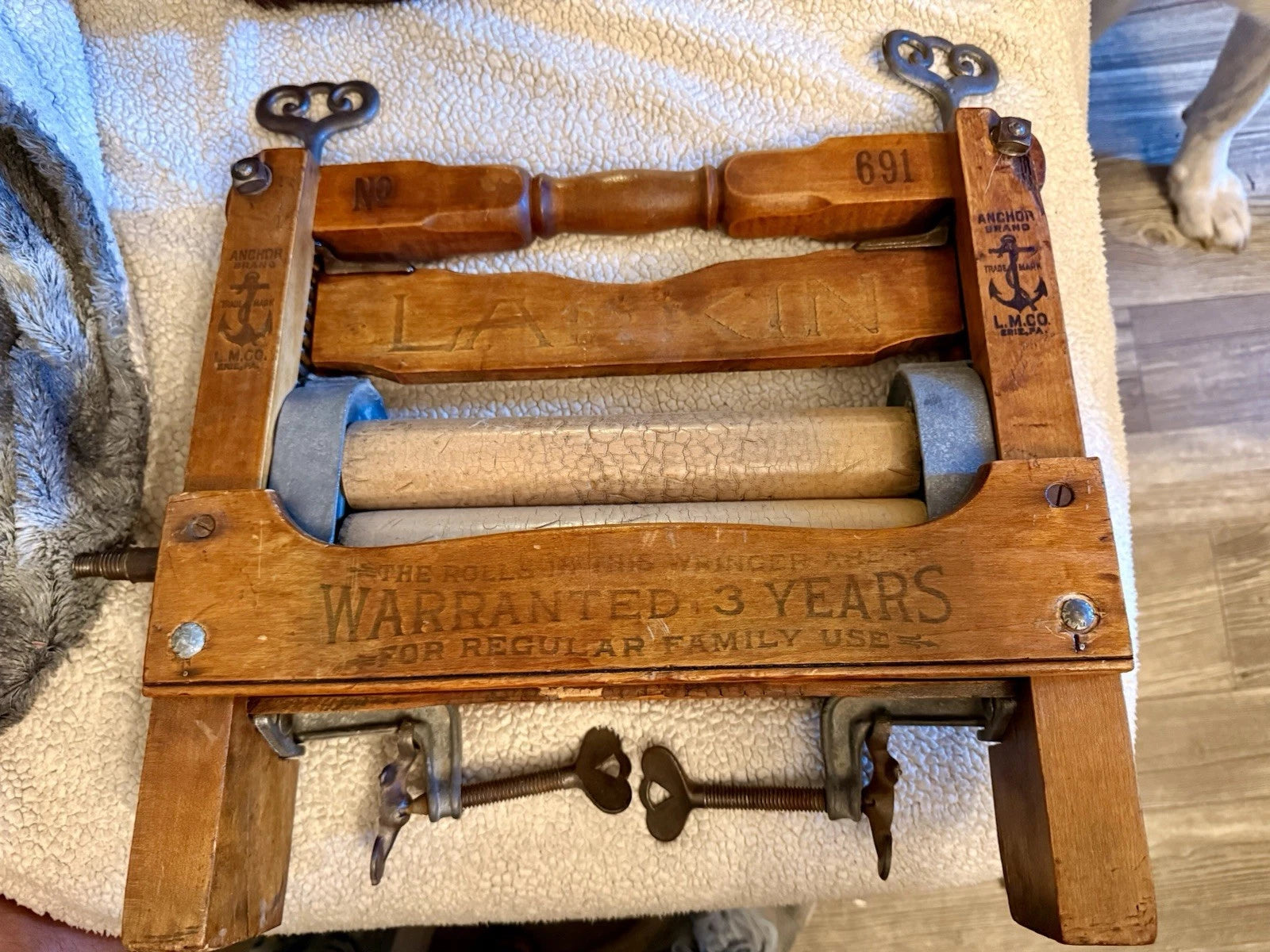 antique clothes wringer, Anchor Brand wringer, Lovell Mfg Co, primitive laundry tool, 1910s farmhouse decor, vintage industrial decor, early American laundry, antique washing machine accessory, rustic home accent, turn of the century tool